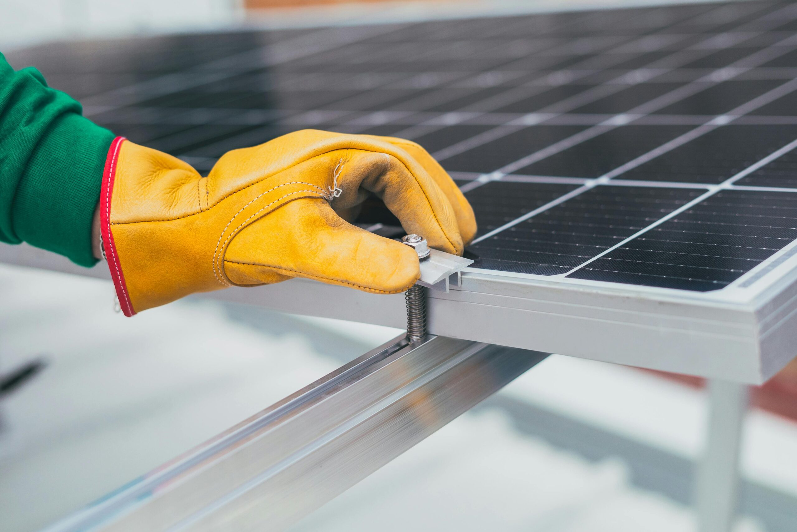 Person s hand on solar panel
